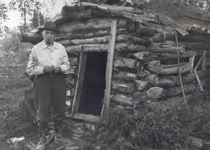 Dr. John F. Thompson at Walter Johnson's line cabin.