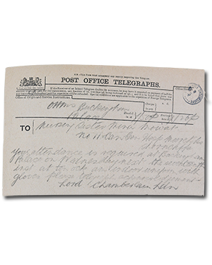 handwritten telegram in scrapbook. “Buckingham Palace. Nursing Section Mina Mowat. No 11 Can Gen Hosp Moore Shorncliffe. Your attendance is required at Buckingham Palace on Wednesday next the seventeenth  inst at ten ock indoor uniform with gloves please telegraph acknowledgement. Lord Chamberlain Ldn.” The caption in the scrapbook is “Telegram from the Lord Chamberlain requesting attendance of Wilhelmina Mowat at Buckingham Palace where she was invested with the Royal Red Cross by His Magesty King George.”