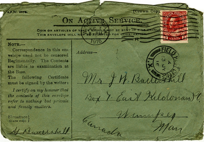 battered green military envelope postmarked 1916