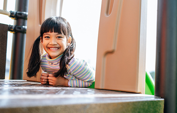 two kids sit on table reading