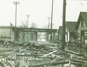Debris scattered under a flooded CNR Line, 1950